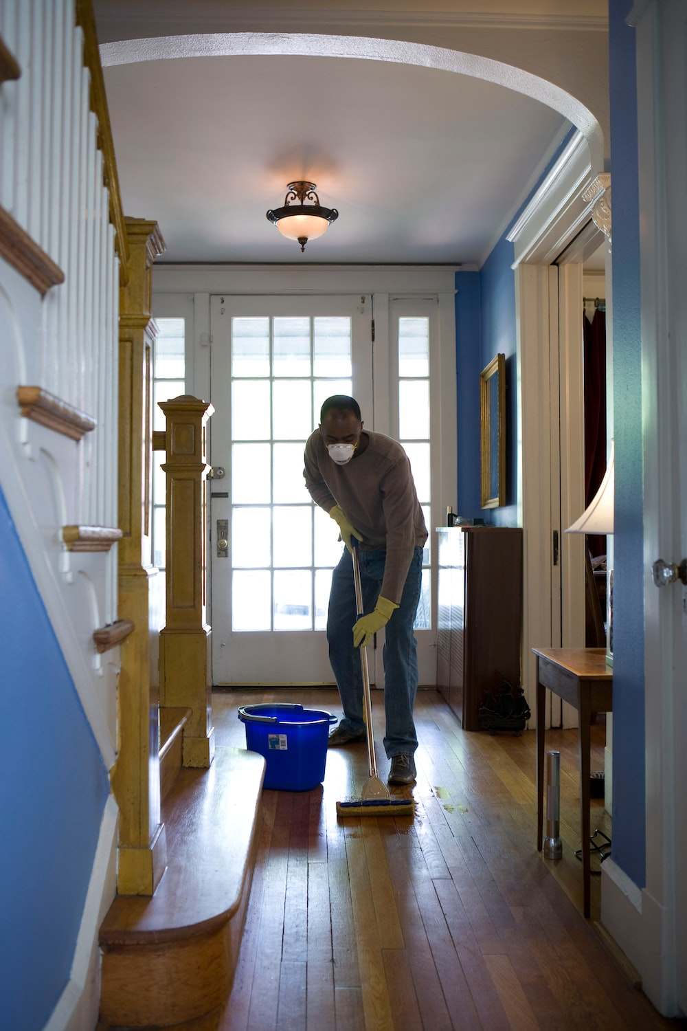 a man cleaning floors.